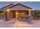 Covered patio with an outdoor bar, providing a great space for relaxation and entertainment at 15881 W Berkeley Rd, Goodyear, AZ 85395