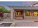 Covered patio featuring a hot tub and ample space for outdoor living and relaxation at 15881 W Berkeley Rd, Goodyear, AZ 85395