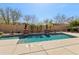 Backyard pool area offering a refreshing escape with desert landscaping and a serene ambiance at 15881 W Berkeley Rd, Goodyear, AZ 85395