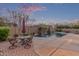 Backyard pool featuring a small fountain, outdoor furniture and privacy fence at 15881 W Berkeley Rd, Goodyear, AZ 85395