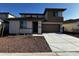 Charming two-story home featuring desert landscaping, a two-car garage, and a welcoming entrance at 17541 W Lupine Ave, Goodyear, AZ 85338