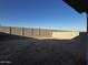 Large backyard featuring a block wall fence offering privacy and security at 17558 W Lupine Ave, Goodyear, AZ 85338