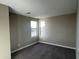 A simple bedroom with neutral walls, carpet and two windows offering neighborhood view at 17558 W Lupine Ave, Goodyear, AZ 85338