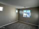 Bedroom featuring neutral paint, carpet floor and two windows bringing in natural light at 17558 W Lupine Ave, Goodyear, AZ 85338