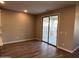 Cozy dining area with sliding glass doors to the patio and wood-look tile flooring at 17558 W Lupine Ave, Goodyear, AZ 85338