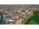 An elevated view of community homes near a golf course, showcasing the neatly planned neighborhood and common areas at 17642 N Ironhorse Dr, Surprise, AZ 85374