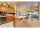 Open bar area featuring cabinetry, wine cooler, and seamless transition to living spaces at 17642 N Ironhorse Dr, Surprise, AZ 85374