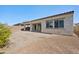 Large backyard featuring desert landscaping, block wall, covered patio, and room to create your outdoor dream space at 1800 N 156Th Dr, Goodyear, AZ 85395