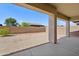 Expansive backyard featuring low-maintenance desert landscaping, block wall, and a covered patio at 1800 N 156Th Dr, Goodyear, AZ 85395