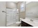 Bathroom featuring a glass-enclosed shower, a window with shutters, and a white toilet at 1800 N 156Th Dr, Goodyear, AZ 85395