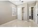 Bedroom featuring tile floors, a shuttered window, and a closet with sliding doors at 1800 N 156Th Dr, Goodyear, AZ 85395