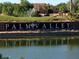 Palm Valley community sign reflected in the lake, capturing the essence of the neighborhood at 1800 N 156Th Dr, Goodyear, AZ 85395