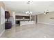 Spacious living room and kitchen area with tile flooring and ample natural light at 1800 N 156Th Dr, Goodyear, AZ 85395