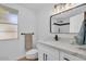 Bathroom with marble countertops and new fixtures at 18402 N 94Th Dr, Sun City, AZ 85373