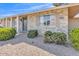 Close up exterior of a single Gathering home with desert landscaping and a well kept lawn at 18402 N 94Th Dr, Sun City, AZ 85373