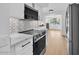 Bright kitchen with marble countertops, stainless steel appliances, and open floorplan at 18402 N 94Th Dr, Sun City, AZ 85373