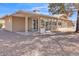 Back patio of home with views, covered area, neutral paint, and desert landscaping at 18402 N 94Th Dr, Sun City, AZ 85373