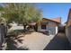 This home features a private backyard with mature trees and a covered patio at 18660 N 71St Ln, Glendale, AZ 85308