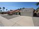 Inviting single-Gathering home with desert landscaping, a two-car garage, and a red tile roof at 18660 N 71St Ln, Glendale, AZ 85308