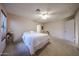 Bright bedroom with a ceiling fan, soft carpeting, and a tranquil atmosphere for ultimate relaxation and comfort at 18660 N 71St Ln, Glendale, AZ 85308