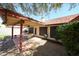 Covered patio has tiled floors and overlooks the spacious backyard at 18660 N 71St Ln, Glendale, AZ 85308