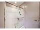 Bathroom featuring a glass door shower with a neutral colored walls at 18660 N 71St Ln, Glendale, AZ 85308