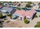 A bird's eye view captures a single Gathering home with great landscaping and a covered patio at 20047 N Shadow Mountain Dr, Surprise, AZ 85374