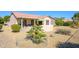 An expansive backyard offers great desert landscaping and privacy at 20047 N Shadow Mountain Dr, Surprise, AZ 85374