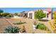 This backyard offers desert landscaping, trees and easy maintenance at 20047 N Shadow Mountain Dr, Surprise, AZ 85374