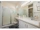 Bathroom featuring long marble vanity and shower with glass door at 20047 N Shadow Mountain Dr, Surprise, AZ 85374