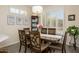 Dining room with shuttered windows and stylish dark wood furniture at 20047 N Shadow Mountain Dr, Surprise, AZ 85374