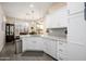 Bright kitchen features white cabinetry, marble countertops, and stainless steel appliances at 20047 N Shadow Mountain Dr, Surprise, AZ 85374