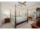 This is a view of the main bedroom, with its four post bed and neutral decor at 20047 N Shadow Mountain Dr, Surprise, AZ 85374