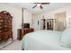 This main bedroom features wooden furniture and an attached bathroom at 20047 N Shadow Mountain Dr, Surprise, AZ 85374