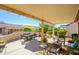 Inviting covered patio with ample seating and decor, perfect for outdoor relaxation and entertaining at 20047 N Shadow Mountain Dr, Surprise, AZ 85374