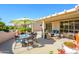 This outdoor patio offers dining and relaxing spaces and desert landscaping at 20047 N Shadow Mountain Dr, Surprise, AZ 85374