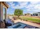 Charming back patio with ample seating and serene views of the lush golf course at 20449 N Lemon Drop Dr, Maricopa, AZ 85138