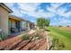 A relaxing patio area with a view of the well-manicured golf course at 20449 N Lemon Drop Dr, Maricopa, AZ 85138