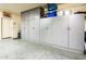 Garage featuring built-in storage cabinets along one wall at 20449 N Lemon Drop Dr, Maricopa, AZ 85138