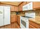 Well-lit kitchen featuring updated appliances, wood cabinets, and granite countertops at 20449 N Lemon Drop Dr, Maricopa, AZ 85138