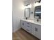 Bathroom with dual sinks, modern black fixtures, and white cabinetry at 2101 S Meridian Rd # 42, Apache Junction, AZ 85120