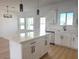 Modern kitchen featuring an island with white cabinets, stainless steel appliances, and pendant lights at 2101 S Meridian Rd # 42, Apache Junction, AZ 85120