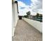 Side yard with gravel landscaping and a low block wall with a decorative fence at 2101 S Meridian Rd # 42, Apache Junction, AZ 85120