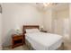 Bright bedroom featuring ceiling fan, and bedside tables at 26065 N 68Th Ln, Peoria, AZ 85383