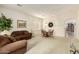 Cozy living room and dining area filled with natural light, perfect for relaxation and entertaining at 26065 N 68Th Ln, Peoria, AZ 85383