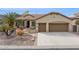 Charming single-story home featuring desert landscaping and a spacious two-car garage at 2634 N 164Th Ave, Goodyear, AZ 85395