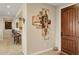 Home foyer featuring a wooden front door, stylish wall art, and tile flooring at 2634 N 164Th Ave, Goodyear, AZ 85395