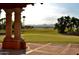 Scenic view of a well-maintained golf course with lush green grass, distant mountains, and palm trees in Arizona at 2634 N 164Th Ave, Goodyear, AZ 85395