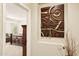 Hallway with view of bedroom and decorative wall art at 2634 N 164Th Ave, Goodyear, AZ 85395