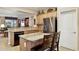 Spacious kitchen featuring a stainless steel refrigerator, granite countertops, and wooden cabinetry at 2634 N 164Th Ave, Goodyear, AZ 85395